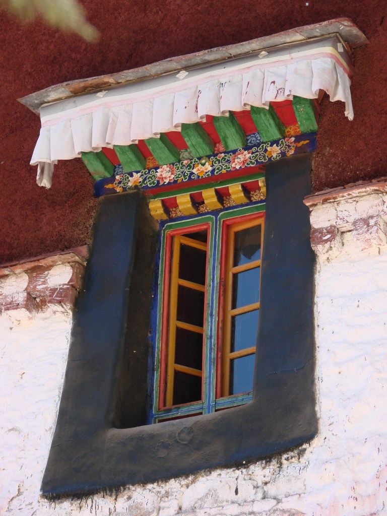 Tibetan design - chain of flowers painted with gold, orange, crimson, and dark indigo