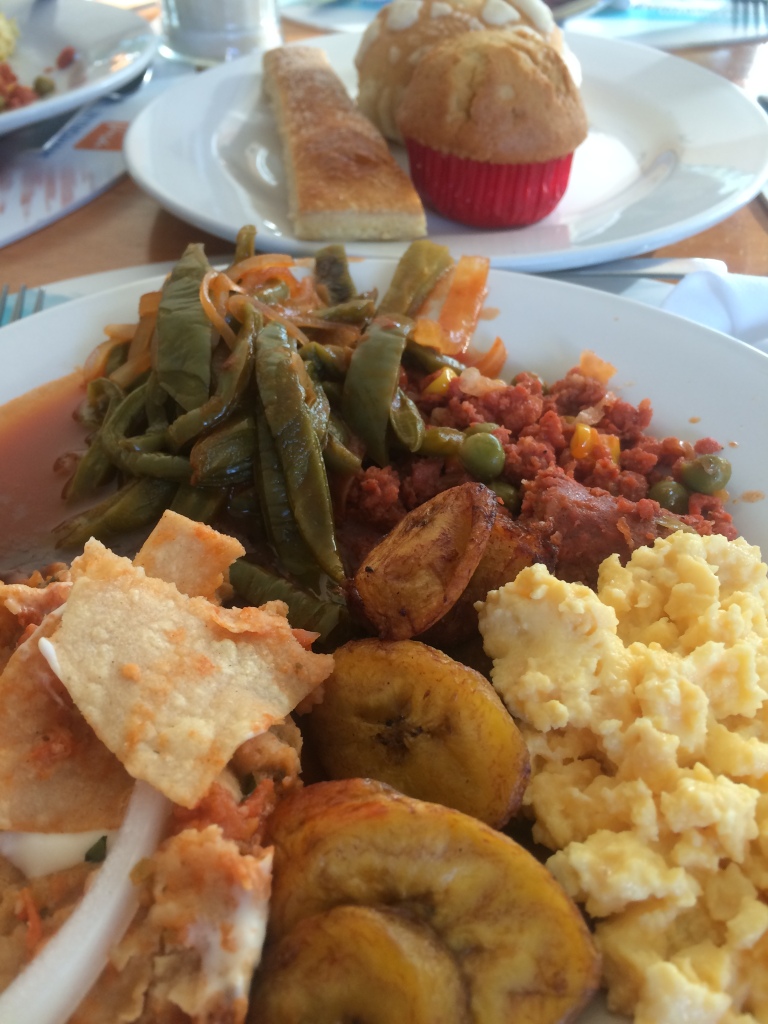 chilaquiles, cactus dish, chorizo, fried plantains, and eggs - breakfast from Yucatán