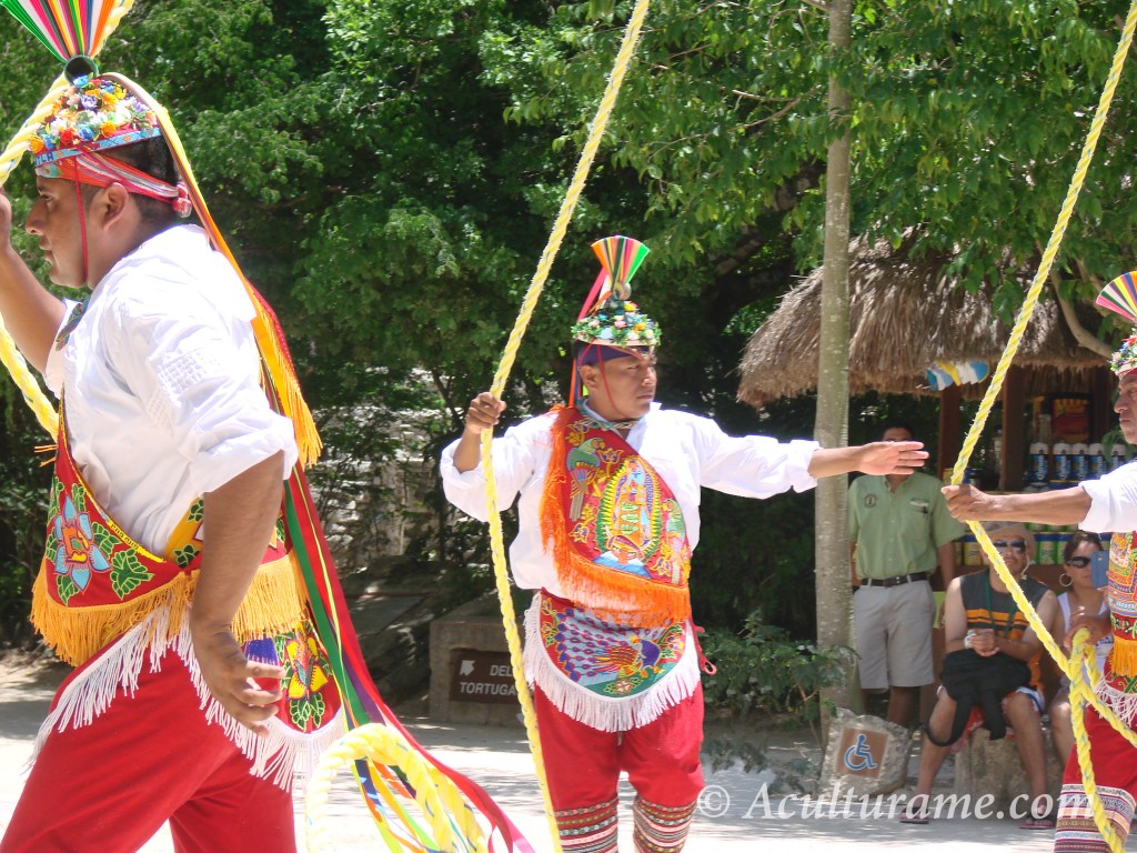 spectators watch in astonishment the long wooden pole