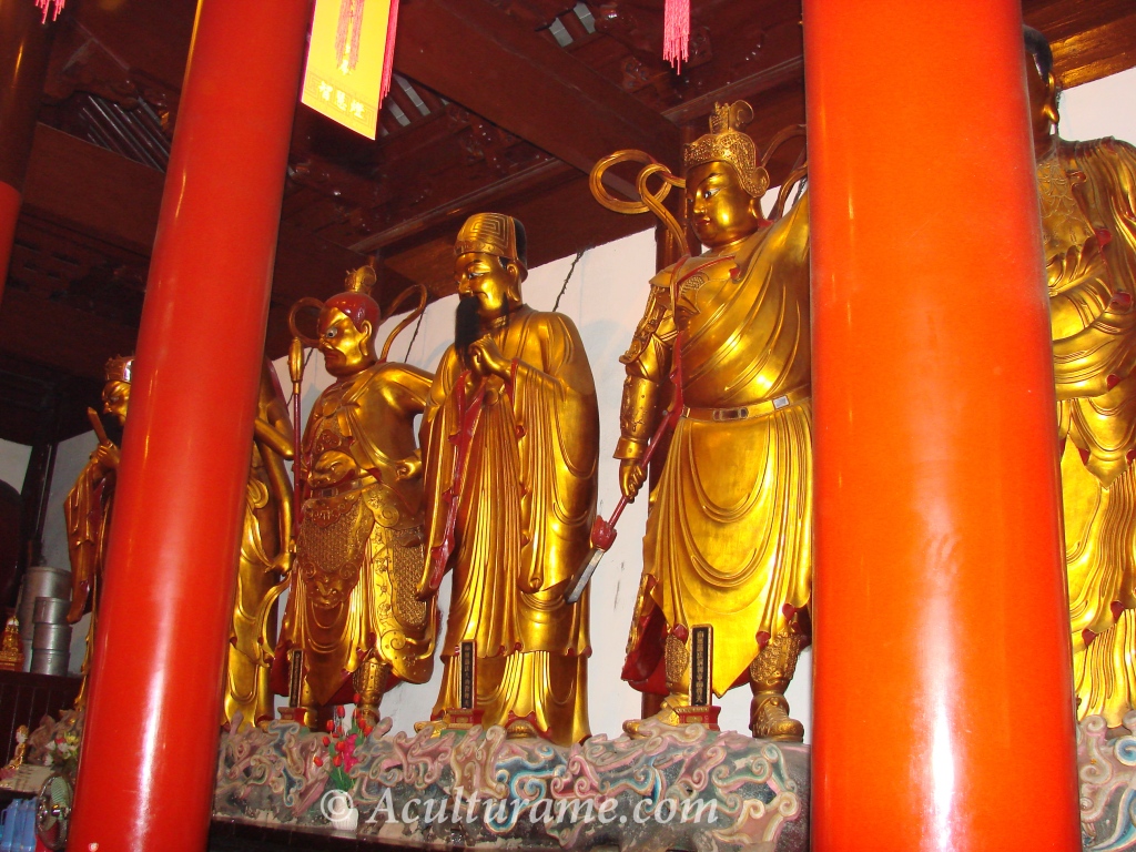Buddhist figures and statues stand in erect posture