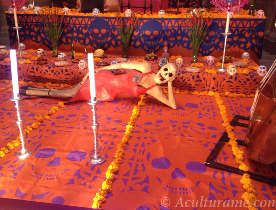 On Día de los Muertos in Mexico the streets are filled with decorations of papel picado , flowers, calaveras (sugar skulls), and parades.