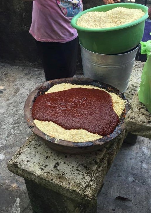 the toasted chile sauce is mixed with the ground corn