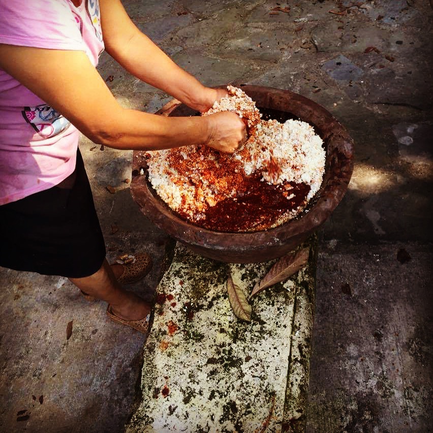mixing chile sauce, corn masa and lard for zacahuil